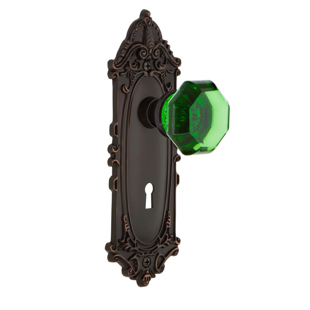 Nostalgic Warehouse VICWAE Colored Crystal Victorian Plate with Keyhole Passage Waldorf Emerald Door Knob in Timeless Bronze